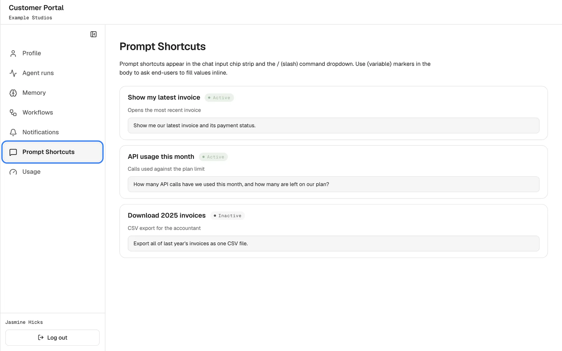 The "Prompt Shortcuts" page as seen by Jasmine Hicks, a Member of "Example Studios": the menu shows only "Profile", "Agent runs", "Memory", "Workflows", "Notifications", "Prompt Shortcuts", highlighted, and "Usage". Her company's shortcuts are listed, "Show my latest invoice" and "API usage this month" ("Active") and "Download 2025 invoices" ("Inactive"), with their descriptions and texts, but there is no "New prompt shortcut" button and no Edit, Disable or Delete buttons. Inactive shortcuts do not appear in the chat.